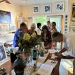 Bidders signing up for bid numbers prior to  the auction to benefit the CRC (Community Resource Council).  LISA KRISTOFF/Boothbay Register