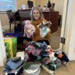 Vice President and Community Engagement Officer Michelle Curtis with hats and mittens. Courtesy photo