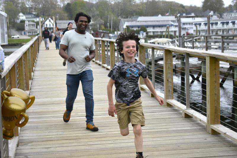 A young attendee races to the finish line during Bigelow Laboratory's 9th annual Fun Run & Walk for Colorectal Cancer Awareness. ISABELLE CURTIS/Boothbay Register