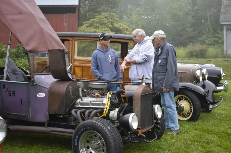 Mark Johnson (far left) of Union brought his 1922 Ford T-bucket to the Antique Auto Show, whose parts he inherited from his father in the 1980s. ISABELLE CURTIS/Boothbay Register
