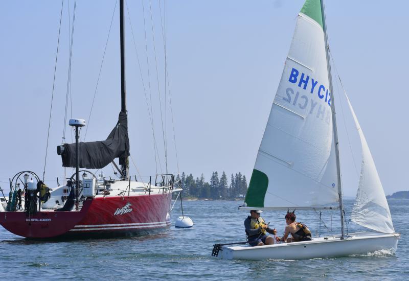 Members of the U.S. Naval Academy’s Offshore Sailing Team from the 'Wahoo' raced with Boothbay Harbor Yacht Club junior sailors in a friendly competition July 15. FRITZ FREUDENBERGER/Boothbay Register