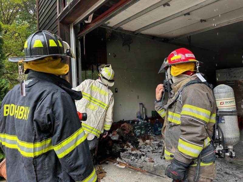 Firefighters at the scene of the fire at 7 Farnham Point Road, East Boothbay, June 30. Mark Sullivan photo