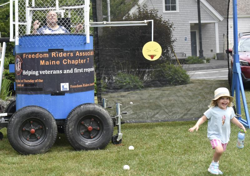 This gleeful wee girl runs back to her family after sinking Marine Corps veteran Charlie Stanley at the BCA's Fourth on the Common July 3. LISA KRISTOFF/Boothbay Register
