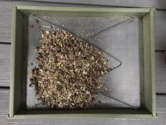 A freshly cleaned bird feeder filled with food waiting to be eaten. Photo courtesy Eliza Nickelson.