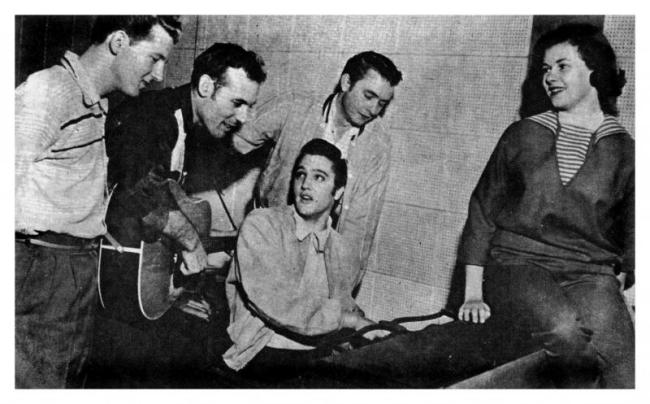 The Million Dollar Quartet. L to R: Jerry Lee Lewis, Carl Perkins, Elvis Presley and Johnny Cash with Marilyn Evans who arrived with Elvis. This was an impromptu jam session involving Elvis Presley, Jerry Lee Lewis, Carl Perkins, and Johnny Cash on December 4, 1956, at the Sun Record Studios in Memphis, Tennessee. This session is considered a seminal moment in rock and roll.