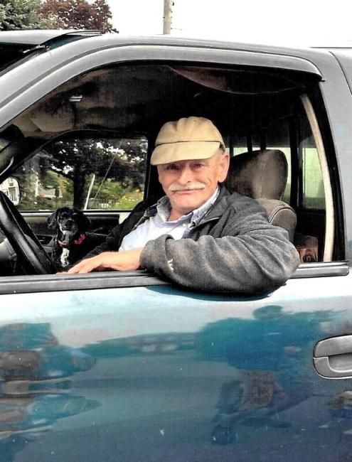 Arthur Carter, 78, and his dog Gizmo, 13, wake up early to begin their newspaper rounds. Courtesy of Arthur Carter