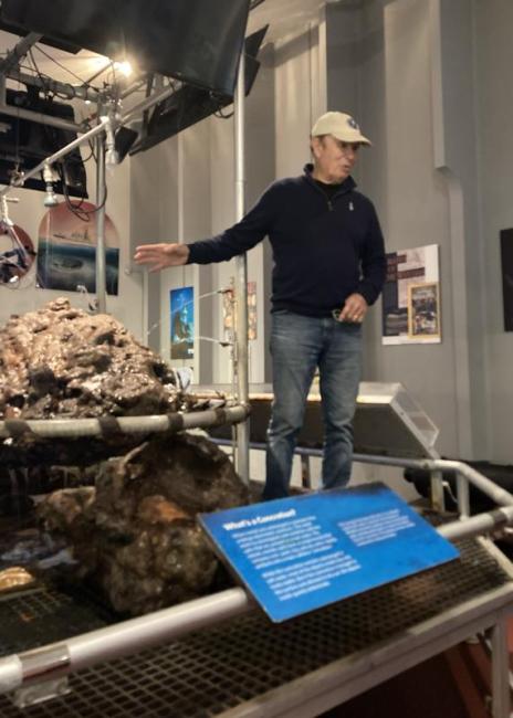 Barry Clifford talks about the concretion behind him that contains a full pirate skeleton with pistol and coin purse - identified in X-ray. Courtesy of Elaine P. Jones