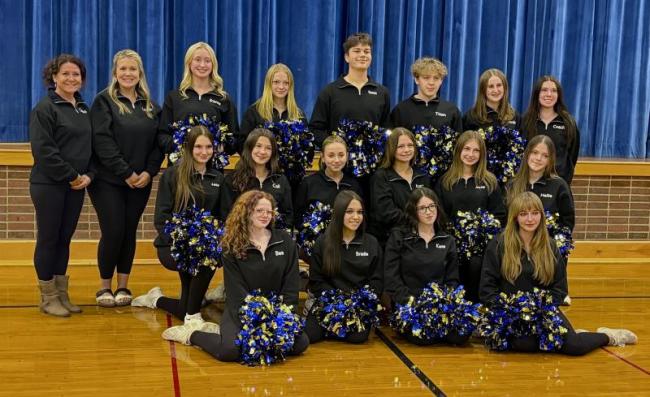 The 2026 Boothbay Region High School cheerleading team. Pictured from left are, front row: Bea Wormwood, Briella Green, Kaye Hallinan, Maya Jacobs; middle row: Ashlynn Andrews, Cali McDuff, Emma Doucette, Izzy Andreasen, Jessie Ullo, Hallie Arbogast; back row:  Coach Michele Ripley, Assistant Christian Jewett, Brianna Campbell, Olivia Rittal, Ronan Drage, Titan Lewis, Annie Whitney and Assistant Mady McLellan. ISABELLE CURTIS/Boothbay Register