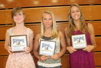 Girls track plaque winners, from left, Sinead Miller, Morgan Crocker and Alexandra Andrews