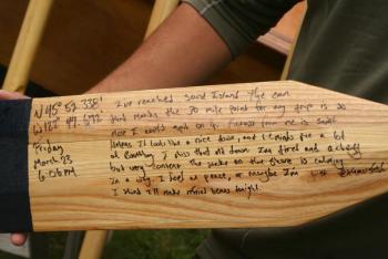 On oars he carved, Karl Berger tracked the time, date, coordinates and his thoughts and impressions of his 100-mile journey down the Columbia River in a boat he built. JOHN MAGUIRE/Boothbay Register Karl Berger, Boothbay, boat, oars, Columbia River, Oregon