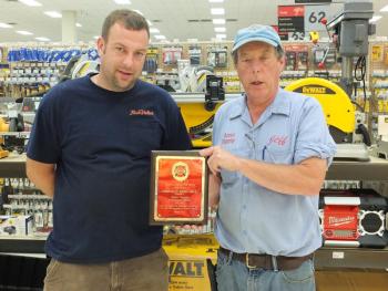 Ame's Supply's Mike and Jeff Averill accept the Lincoln County Fire Chiefs’ Association’s Community Merit Award. KATHY ONORATO/Wiscasset Newspaper