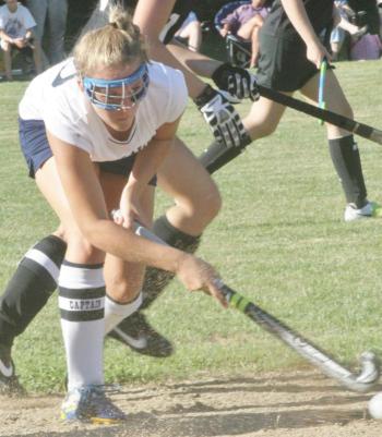 Senior Co-Captain Sarah Caron keeps her eyes on the ball as she tries to pass to a teammate during Wednesday's home and season opener against St. Dom's. Below, Tori Schmid, a junior on the Lady Seahawks field hockey team, dribbles the ball up-field. KEVIN BURNHAM/Boothbay Register Senior Co-Captain Sarah Caron keeps her eyes on the ball as she tries to pass to a teammate during Wednesday's home and season opener against St. Dom's. KEVIN BURNHAM/Boothbay Register