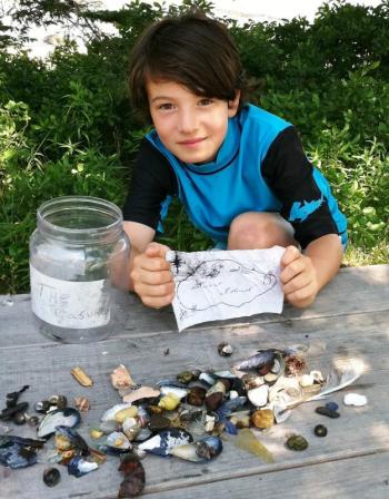 Liam Grogan, 11, with his Burnt Island treasures. Courtesy of Jill Grogan