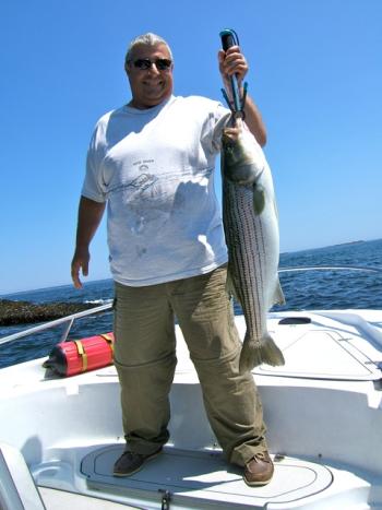 Steve Paternite with a 38-inch, 25-pound striper, boothbay, boothbay harbor