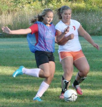 Anna Baumm (left) and Brenna Alley vie for the ball during a scrimmage at the August 30 team practice. LISA KRISTOFF/Boothbay Register Anna Baumm (left) and Brenna Alley vie for the ball during a scrimmage at the August 30 team practice. LISA KRISTOFF/Boothbay Register
