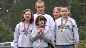 Special Olympians Grace Giles, Valerie Giles, and Vincent Giles front row, stand with Dylan Geyer and long-time teacher and mentor Toby LeConte during Sunday's golf tournament. Special Olympians Grace Giles, Valerie Giles, and Vincent Giles front row, stand with Dylan Geyer and long-time teacher and mentor Toby LeConte during Sunday's golf tournament.