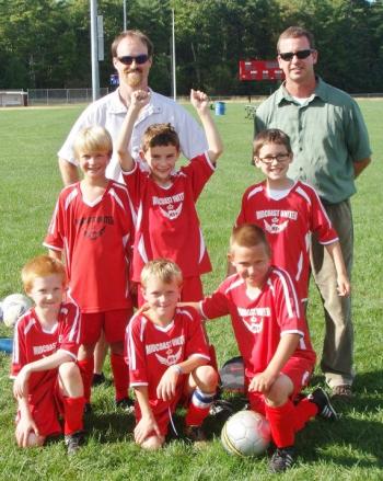 Midcoast United U9 soccer team. From left, front row: Andrew Gudroe; Nathaniel Jewett; Gavin Loupe. Middle row: Jack Duncan; Aiden Foley; Garrett Cossette. Back row: coaches Darrell Gudroe and Paul Foley. Courtesy of Jean Duncan