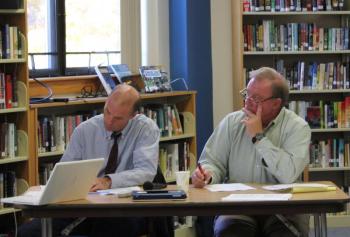 Mark Gorey, left, and Rotarian Bill Bailey listen and take notes during a student presentation. SUE MELLO/Boothbay Register Mark Gorey, left, and Rotarian Bill Bailey listen and take notes during a student presentation. SUE MELLO/Boothbay Register