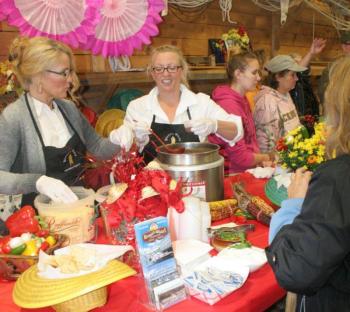 Kelly Flynn, left, and Holly Stover dish out Brown's Wharf first-place chili, made by Micah Jones Kelly Flynn, left, and Holly Stover dish out Brown's Wharf first-place chili, made by Micah Jones