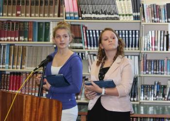 Sophomore Maya Schwehm, left, and junior Courteney Chaney represent The Heritage Foundation in this year’s debate. Here the students give their opening remarks, bolstered by an iPad chock full of data. Below: Mark Gorey, left, and Rotarian Bill Bailey listen and take notes during a student presentation. Third photo: Debaters and the audience, including Principal Dan Welch, listen intently to opening remarks on October 26. SUE MELLO/Boothbay Register Sophomore Maya Schwehm, left, and junior Courteney Chaney represent The Heritage Foundation in this year’s debate. Here the students give their opening remarks, bolstered by an iPad chock full of data.