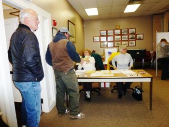 Volunteers hand out ballots. Volunteers hand out ballots.