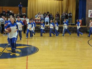 Lady Seahawks make their entrance, led by senior captain, Sarah Caron.  RYAN LEIGHTON/ Boothbay Register 