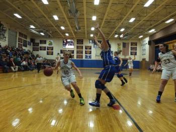 Freshman guard Hannah Morley handles the ball with precision, as she drives down the lane. RYAN LEIGHTON/Boothbay Register 