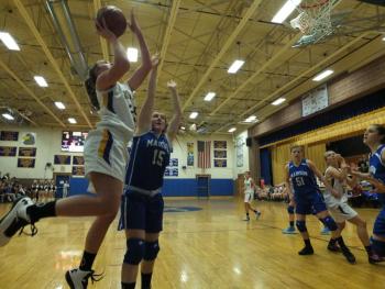 Alex Clarke gets to the rim against Madison. Clarke finished with 12 points and nine rebounds. RYAN LEIGHTON/Boothbay Register 