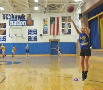 Sophomore Sarah Durgan puts up a long jump shot at practice. RYAN LEIGHTON/Boothbay Register