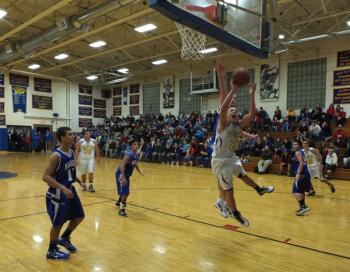 Junior guard Andrew Hallinan powers to the basket against Madison. RYAN LEIGHTON/Boothbay Register