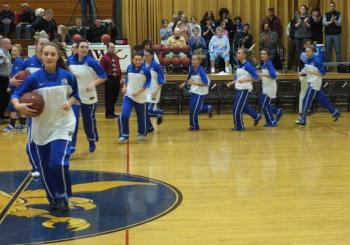 The Lady Seahawks make their entrance into Porter Memorial Gymnasium led by senior captain Sarah Caron.  