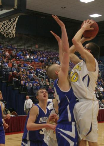Evan Hepburn shoots over Madison's Steven Lawrence for two points in the second half. KEVIN BURNHAM/Boothbay Register Evan Hepburn shoots over Madison's Steven Lawrence for two points in the second half. KEVIN BURNHAM/Boothbay Register