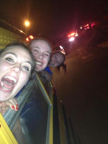 The senior captains Allison Crocker, Alex Clarke and Sarah Caron hang out of the school bus windows while parading through Boothbay Harbor, February 21. Courtesy of Hannah Morley. The senior captains Allison Crocker, Alex Clarke and Sarah Caron hang out of the school bus windows while parading through Boothbay Harbor, February 21. Courtesy of Hannah Morley