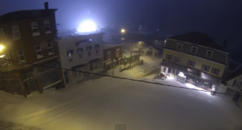 An electrical explosion at the head of Boothbay Harbor causes a flash of light during the snow storm February 9. RYAN LEIGHTON/Boothbay Register	
