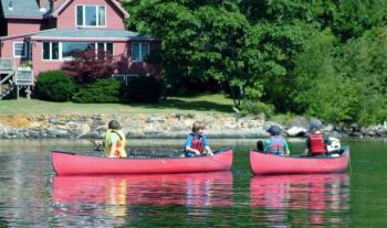 Participants in the Boothbay Region YMCA's half-day fishing camp. Below: One of Camp Knickerbocker's safety drill exercises: learning to swamp a canoe. Courtesy of Earl Brewer Courtesy of Earl Brewer Participants in the Boothbay Region YMCA's half-day fishing camp.