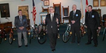 Before giving away 21 new bicycles,Tom Pulkkinen of Bay View Lodge, second from left, explains to parents, grandparents and children about the Bikes for Books program and how it came to be implemented locally during the presentation at the Masonic Hall in East Boothbay on Saturday, March 16. Standing behind Pulkkinen are local Masons, from left, Arthur Richardson, Kim Pinkham and Micheal Leighton. Below: Charlie Moss shows his pleasure in earning one of the 21 bicycles from area Masons through the summer reading program offered at the Boothbay Harbor Memorial Library. KEVIN BURNHAM/Boothbay Register Before giving away 21 new bicycles,Tom Pulkkinen of Bay View Lodge, second from left, explains to parents, grandparents and children about the Bikes for Books program and how it came to be implemented locally during the presentation at the Masonic Hall in East Boothbay on Saturday, March 16. Standing behind Pulkkinen are local Masons, from left, Arthur Richardson, Kim Pinkham and Micheal Leighton.