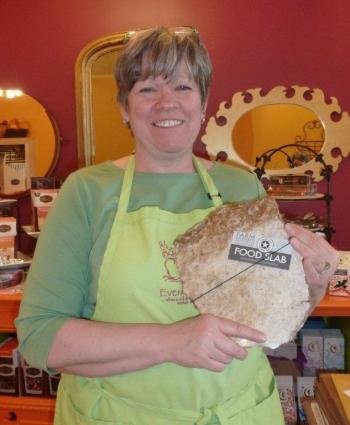 Owner Denise Demeter holds a Food Slab board, one of the many new products being sold at Eventide Artisan Bread & Cheese. KATRINA CLARK/Boothbay Register Owner Denise Demeter holds a Food Slab board, one of the many new products being sold at Eventide Artisan Bread & Cheese. KATRINA CLARK/Boothbay Register