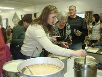 Kelsy Hartley decides on one of the 20-plus soups, chowders and stews donated for this year's fundraising event. LISA KRISTOFF/Boothbay Register Kelsy Hartley decides on one of the 20-plus soups, chowders and stews donated for this year's fundraising event. LISA KRISTOFF/Boothbay Register