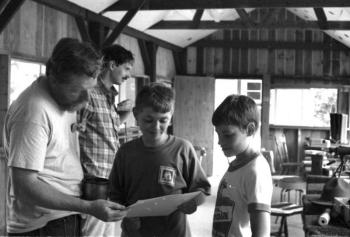 July, 1991: Scouts Eric Schmidt and Gearry Judkins seem happy with a freshly shot target during merit badge work. Instructors Earl Leavitt, foreground, and Carl Schmidt were among several certified members available for BSA and Hunter Safety programs. Courtesy of Lucy Schmidt July, 1991: Scouts Eric Schmidt and Gearry Judkins seem happy with a freshly shot target during merit badge work. Instructors Earl Leavitt, foreground, and Carl Schmidt were among several certified members available for BSA and Hunter Safety programs. Courtesy of Lucy Schmidt