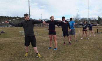 Javelin throwers poised to throw spears during track and field practice at Boothbay Region High School April 2. Below: Antonio Maulolo, a new face on the team, is learning the technique of throwing the shot put. RYAN LEIGHTON/Boothbay Register Javelin throwers poised to throw spears during track and field practice at Boothbay Region High School April 2. RYAN LEIGHTON/Staff Reporter