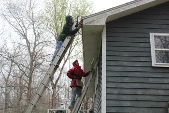 Bill Hamblen and Derek Abbot make repairs at a house on King Phillips Trail. SUE MELLO/Boothbay Register Bill Hamblen and Derek Abbot make repairs at a house on King Phillips Trail. SUE MELLO/Boothbay Register