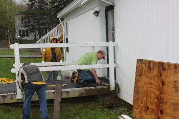 Dean Domeyer, Tiger and Peanut fixing a ramp at the Boothbay Green. SUE MELLO/Boothbay Register Dean Domeyer, Tiger and Peanut fixing a ramp at the Boothbay Green. SUE MELLO/Boothbay Register