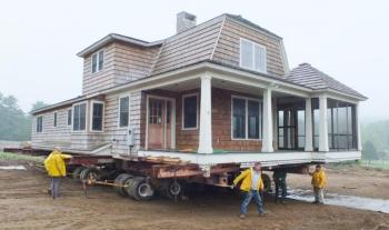 The house formerly owned by George Whitten is propped up on iron beams and hydraulic jacks. Workers from Jewett Builders prepare for the big move. RYAN LEIGHTON/Boothbay Register The house formerly owned by George Whitten is propped up on iron beams and hydraulic jacks. Workers from Jewett Builders prepare for the big move. RYAN LEIGHTON/Boothbay Register