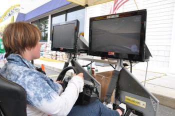 Mariah Mann, 15, tries driving in a NASCAR simulator. BEN BULKELEY/Wiscasset Newspaper 