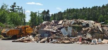 A 200-ton pile of demolition wood sits at the Boothbay Region Refuse Disposal District. The transfer station is having problems getting rid of its wood once it gets grounded up into woodchips. RYAN LEIGHTON/Boothbay Register