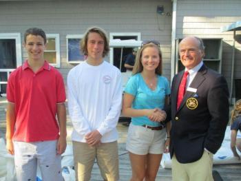 Officers of the Boothbay Harbor Yacht Club's Junior Yacht Club are congratulated by BHYC Commodore Neil Newton, right. From left are Aidan Clark, Dungan Milhouse and Catherine Clark. Courtesy of Andy Holmes