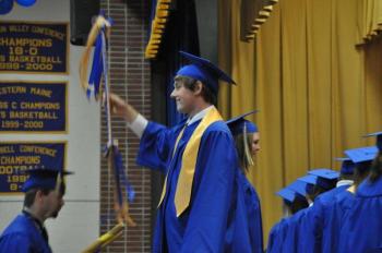 Class marshal Daniel Murray flashes a smile as his classmates arrive on the stage. BEN BULKELEY/Boothbay Register Class marshal Daniel Murray flashes a smile as his classmates arrive on the stage. BEN BULKELEY/Boothbay Register