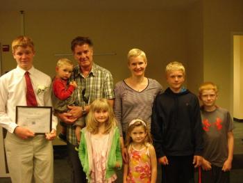 Liam Conlin left, stands with his family at the Young Entrepreneurs Academy Commencement. At his left are Desmond (held by the Conlin patriarch, Robert), mother Eve, Nolan, Patrick; front, Nora and Iris. Courtesy of Southern Midcoast Maine Chamber