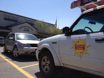 A work truck from Revision Energy parks at the local YMCA. ReVision Energy looks to expand the region's solar capabilities, despite that one of the major players withdrew from the project. RYAN LEIGHTON/ Boothbay Register
