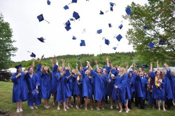 The BRHS Class of 2013 celebrates with the traditional tossing of their caps following the graduation ceremony June 7. BEN BULKELEY/Boothbay Register